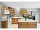 Well-lit kitchen boasts an island, white countertops, and stainless steel appliances at 1013 Chapman Blvd, Greenfield, IN 46140