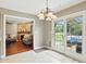 Charming kitchen nook leads to the outside patio and comfortable living room at 1013 Chapman Blvd, Greenfield, IN 46140