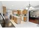 Eat-in kitchen features an island and a view into the living room at 1013 Chapman Blvd, Greenfield, IN 46140