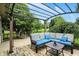 Inviting outdoor patio with a comfortable sectional sofa and pergola, perfect for relaxing or entertaining guests at 1013 Chapman Blvd, Greenfield, IN 46140