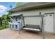 Relax on this patio with a swing and a custom-built serving and storage station at 1013 Chapman Blvd, Greenfield, IN 46140