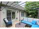 Charming covered patio with outdoor furniture, offering a relaxing space for enjoying the outdoors at 1013 Chapman Blvd, Greenfield, IN 46140