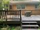 Spacious wooden back deck with stairs, ideal for outdoor gatherings and relaxation at 106 N 300 W, Greenfield, IN 46140