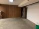 Unfinished basement with concrete floors, dark wood trim, and a single door at 106 N 300 W, Greenfield, IN 46140