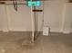 Unfinished basement concrete floor with window well and floor drain at 106 N 300 W, Greenfield, IN 46140
