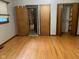 Bedroom featuring hardwood floors and access to closet, offering a functional layout at 106 N 300 W, Greenfield, IN 46140