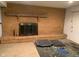 Finished basement brick fireplace featuring a raised hearth, log mantle and screen at 106 N 300 W, Greenfield, IN 46140