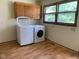 Convenient laundry area with modern washer and dryer units, set in a well-lit room at 106 N 300 W, Greenfield, IN 46140
