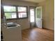 Practical laundry room with a washing machine and door to the outside, offering convenience at 106 N 300 W, Greenfield, IN 46140