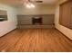 Spacious living room with hardwood floors and a stone fireplace, offering a cozy and inviting atmosphere at 106 N 300 W, Greenfield, IN 46140
