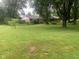 Expansive grassy lot with mature trees and shade at 106 N 300 W, Greenfield, IN 46140