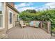 Relaxing back deck with seating and a view of the private backyard at 11123 Garrick St, Fishers, IN 46038