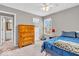 Bedroom with neutral paint, carpet, and a large closet, plus natural lighting at 11123 Garrick St, Fishers, IN 46038