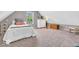 Spacious bedroom with neutral tones, a large window, and carpeted floors at 11123 Garrick St, Fishers, IN 46038