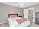 Bedroom with neutral paint and carpet plus a ceiling fan and walk-in closet at 11123 Garrick St, Fishers, IN 46038