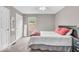 Nicely decorated bedroom featuring neutral paint, plush carpet, and natural lighting at 11123 Garrick St, Fishers, IN 46038