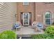 Inviting front porch with seating, creating a welcoming entrance to the home at 11123 Garrick St, Fishers, IN 46038