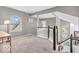 Comfortable loft area featuring neutral paint, carpet, and natural light from windows at 11123 Garrick St, Fishers, IN 46038