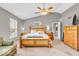 Spacious main bedroom with tall ceilings, ceiling fan, and plenty of natural light at 11123 Garrick St, Fishers, IN 46038