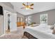Large main bedroom featuring vaulted ceilings, ceiling fan, and en suite bath at 11123 Garrick St, Fishers, IN 46038