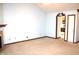 Spacious living room featuring a fireplace, neutral carpet, and access to the kitchen and other rooms at 126 Old Farm Rd, Danville, IN 46122