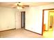 Main bedroom with carpet, ceiling fan, and en-suite bathroom offering comfort and convenience at 126 Old Farm Rd, Danville, IN 46122