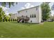 Spacious backyard features a well-maintained lawn and a wooden deck, perfect for outdoor living at 13214 Dunwoody Ln, Carmel, IN 46033
