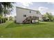 Expansive backyard with lush green grass and a deck provides an ideal space for entertaining and relaxation at 13214 Dunwoody Ln, Carmel, IN 46033