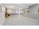 Finished basement boasts open space with carpet flooring and neutral paint, perfect for entertaining at 13214 Dunwoody Ln, Carmel, IN 46033