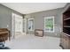 Bedroom features neutral walls, carpet, and bright natural light from two windows at 13214 Dunwoody Ln, Carmel, IN 46033