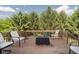 Outdoor deck with a table and chairs, surrounded by lush trees and a view at 13214 Dunwoody Ln, Carmel, IN 46033