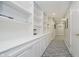 Hallway features custom built-in shelving and carpet flooring at 13214 Dunwoody Ln, Carmel, IN 46033