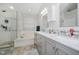 Updated main bathroom with double sink vanity, garden tub, shower, and ceramic tile at 13214 Dunwoody Ln, Carmel, IN 46033