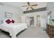 Spacious main bedroom with cathedral ceiling, ceiling fan, and ensuite bath at 13214 Dunwoody Ln, Carmel, IN 46033