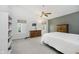 Spacious main bedroom with cathedral ceiling, ceiling fan, and light-colored walls at 13214 Dunwoody Ln, Carmel, IN 46033