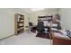 Home office features carpet, shelving, and a desk area at 13214 Dunwoody Ln, Carmel, IN 46033