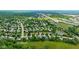 Aerial view of the neighborhood showing proximity to highway, mature trees, and pond near 13470 Shakamac at 13470 Shakamac Dr, Carmel, IN 46032