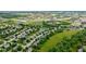 Beautiful aerial view of a residential area featuring ponds, green space, and easy highway access at 13470 Shakamac Dr, Carmel, IN 46032