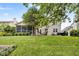 Backyard featuring well maintained lawn, landscaping, screened in porch and room for outdoor entertaining at 13470 Shakamac Dr, Carmel, IN 46032