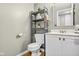 Cozy half bathroom with modern vanity, neutral decor, and space-saving storage at 13470 Shakamac Dr, Carmel, IN 46032