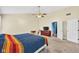 Spacious primary bedroom with a ceiling fan, ensuite bathroom, and neutral decor at 13470 Shakamac Dr, Carmel, IN 46032