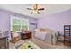 Comfortable bedroom with a playful design, featuring a desk, daybed, and ample natural light at 13470 Shakamac Dr, Carmel, IN 46032