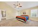 Bright Primary bedroom with a vaulted ceiling, carpeted floors, and multiple windows at 13470 Shakamac Dr, Carmel, IN 46032