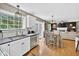 The kitchen seamlessly connects to the living room with a great layout and access to the backyard at 13470 Shakamac Dr, Carmel, IN 46032