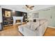 Inviting living room with fireplace, modern decor, and a comfortable sectional sofa creates a cozy atmosphere at 13470 Shakamac Dr, Carmel, IN 46032