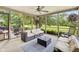 Cozy screened in porch with seating and string lights providing a relaxing outdoor space at 13470 Shakamac Dr, Carmel, IN 46032