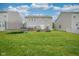 Spacious backyard with a deck, trampoline and lush lawn for outdoor enjoyment at 13884 Wendessa Dr, Fishers, IN 46038
