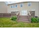 Backyard with deck and stairs leading to a yard featuring lush green grass at 13884 Wendessa Dr, Fishers, IN 46038