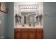 Bathroom featuring double sink vanity, large mirror, decorative lighting and walk-in shower at 13884 Wendessa Dr, Fishers, IN 46038