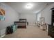 Spacious bedroom with a dark wood crib, desk, and ample carpet space at 13884 Wendessa Dr, Fishers, IN 46038